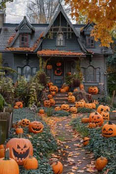 a house with lots of pumpkins in front of it