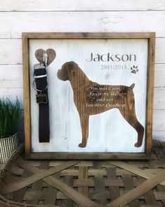 a wooden sign with a dog's name and a leash attached to the front