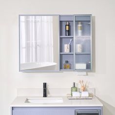 a bathroom with a sink, mirror and cabinets