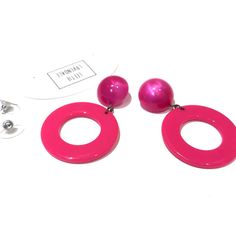 Fuchsia or hot pink Go-Go hoop drops from vintage aura glow lucite studs. Geometric lucite earrings made with vintage parts. These are big & make a statement. Mod meets 80's opulence. Measures just under 2.25" or 60mm from top to bottom, but super lightweight with just enough swing to make a statement. Earrings are made with vintage lucite parts that were made in Rhode Island in the 1960's - early 80's by Best Plastics. We hand-set them with surgical steel earring posts and they have sturdy surg Retro Pink Drop Earrings, Bold Pink Party Earrings, Bold Pink Earrings For Party, Retro Pink Earrings For Party, Retro Pink Party Earrings, Lucite Earrings, Surgical Steel Earrings, Earring Posts, Vintage Lucite