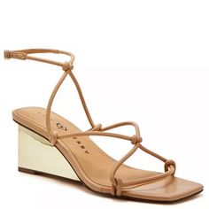 The Irisia Strappy By Katy Perry Has Slender Straps Adorning The Upper Of A Mid-Wedge Sandal. The Perfect Wedge Sandal To Pair With Your Favorite Summer Attire Whether You Are Dressing For A Casual Or Dressy Look. Heel Height- 2.36", Wedge Heel Buckle Closure Shoe Width- Medium Upper, Lining, Outsole- Manmade Square Toe Manmade Spot Clean Imported Never Worn Adjustable Gold Heels For Spring, Elegant Strappy Wedge Sandals For Summer, Spring Strappy Wedge Sandals With Wrapped Heel, Beige Strappy Wedge Sandals For Spring, Elegant Adjustable Wedge Sandals For Spring, Spring Formal Beige Wedge Sandals, Strappy Wedge Sandals For Spring Parties, Spring Formal Wedge Sandals With Wrapped Heel, Formal Spring Wedge Sandals With Wrapped Heel