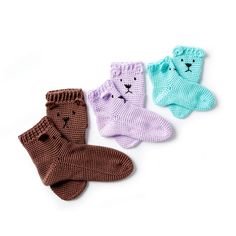 three pairs of knitted baby socks with cats on the front and one cat on the back