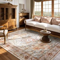 a living room filled with furniture and a large rug on top of a hard wood floor