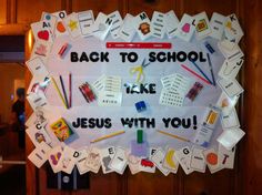 a bulletin board that has been decorated with school supplies and words on the front door