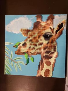 a painting of a giraffe with sunglasses on it's face is shown