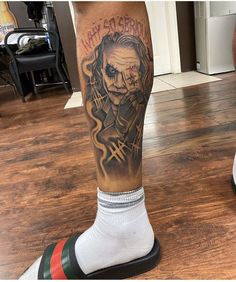 a man with a tattoo on his leg