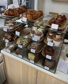 a display case filled with lots of different types of baked goods