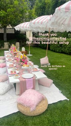 a table set up with pink and white decor for a birthday party in the backyard