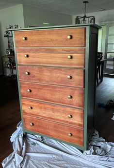 a large wooden dresser sitting on top of a hard wood floor