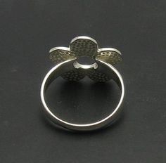 Sterling silver ring 925/1000, flower. Stamped 925.Approximate weight 3.7 grams. Dimensions 1.8x1.8 cm (0.72x0.72 inches). All our jewels are made from solid sterling silver 925/1000 and are carefully crafted by hand in our family workshop. We dispatch your orders in 5 working days, worldwide and the postage is $5. We ship registered priority mail. Please allow 5-7 working days for delivery in Europe and 10-15 working days outside Europe. For any questions - please do not hesitate to contact me! Adjustable Silver Flower Ring, Silver Flower Ring Stamped 925, Silver Flower Ring In Sterling Silver Stamped 925, Hallmarked Sterling Silver Flower Ring, Hallmarked Silver Flower Ring, White Gold Flower Ring Stamped 925, Silver Sterling Silver Flower Ring With Polished Finish, Sterling Silver Flower Ring With Polished Finish, Hallmarked White Gold Flower Ring