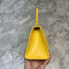 SHOP MORE LUXURY PRODUCTS HERE Description Balenciaga Hourglass Small Handbag In Yellow, For Women, Women’s Bags 9in/23cm Size:ÃƒÂ¯Ã‚Â¿Ã‚Â½ÃƒÂ¯Ã‚Â¿Ã‚Â½ÃƒÂ¯Ã‚Â¿Ã‚Â½ÃƒÂ¯Ã‚Â¿Ã‚Â½ 23 x 15 x 10 cm / 9 x 5.9 x 3.9 inches (Lenght x Height x Width) HandbagCurvilinear baseOne handleAdjustable and removable crossbody strapStudded magnet closureB logo hardware1 back pocket1 inner zipped pocket Includes box, dust bag.This product is of the premium quality. Dior Shirt, Gucci Shirt, Louis Vuitton Shirt, Chanel Shirt, Small Handbag, Reversible Belt, Luxury Products, Small Handbags, Belts For Women