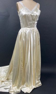 a white dress is shown on a mannequin