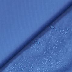 blue fabric with water drops on it