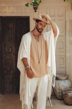 White Raw Cotton Minimalist Poncho for Men | AYA Sacred Wear Men’s Bali Outfits, Bohemian Style Clothing Men, Mens Boho Chic Style, Tuluminati Outfit Hombre, Morocco Men Fashion, Cochella Outfits 2023 Men, Tulum Outfits Men, Hippie Outfits Hombre, Bohemian Men Outfit