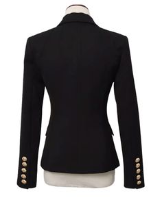 Tanya Black Double Breasted Blazer with Gold Buttons - SLIM FITFeatures: - Slim Fit Design - Single Gold Button Closure - Gold Button Cuffs - Peak Lapels - Two Faux Side Pockets - Shoulder Padding The Tanya Black Double Breasted Blazer is the ultimate must-have for any wardrobe: the perfect classic black blazer for women. This blazer is expertly crafted to perfection, with an exquisite blend of style and functionality that is sure to impress. The gold button detailing adds a touch of luxury and Black Blazer For Women, Black Double Breasted Blazer, Blazer For Women, Breasted Blazer, Double Breasted Blazer, Black Blazer, Gold Buttons, Blazers For Women, Modern Woman