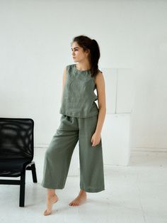 "Moss green culottes linen pants for woman. Midi loose flared pants with pockets. Choose size: XS Waist 66 - 68 cm. / (26\" - 26 3/4\") Hips 90 - 92 cm. / (35 1/2\" - 36 1/4\") S Waist 70 - 72 cm. / (27 3/4\" - 28 1/4\") Hips 94 - 96 cm. / (37\" - 37 3/4\") M Waist 74 - 76cm. / (29 1/4\" - 30\") Hips 98 - 100 cm. / (38 1/2\" - 39 1/4\") L Waist 78 - 80 cm. / (30 3/4\" - 31 1/2\") Hips 102 - 104 cm. / (40 1/4\" - 41\") XL Waist 82 - 84 cm. / (32 1/4\" - 33\") Hips 106 - 108 cm. / (41 3/4\" - 42 1 Casual Green Wide-leg Culottes, Green Relaxed Fit Wide Leg Pants, Spring Green Wide-leg Culottes, Green Wide Leg Culottes For Spring, Khaki Wide-leg Linen Pants, Spring Khaki Linen Pants, Green Linen Wide Leg Pants For Spring, Spring Green Linen Wide Leg Pants, Green Linen Straight Pants