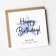 a birthday card with the words happy birthday written in black ink on top of it