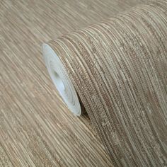 a close up view of a beige wallpaper with vertical stripes on the side and bottom