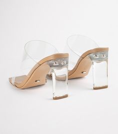 Shine bright in our Chicago heels. A classic mule to take you from day to night, featuring a see-through vinylite upper with an on-trend squared toe-shape and a mid-height heel. -Material: Synthetic Upper & Leather Lining -Sole: Resin -Fit: True to size -Toe-shape: Squared -Features: Two-strap upper -Heel: 8.5cm “WARNING: This product contains chemicals known to the State of California to cause cancer and/or reproductive harm. For more information, visit Visit W3Schools.com!www.P65Warnings.ca.go Thigh High Boots Flat, Block Heel Mule, Embellished Heels, Metallic Shoes, Heels Online, Bridal Heels, Metallic Heels, Tony Bianco, Bow Heels