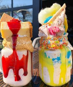 two desserts sitting on top of a wooden table