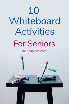 a table topped with lots of different types of pens and tubes on top of it