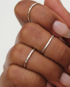 The Silver Hammered Stacking Ring Set features three soldered rings that are handmade to order. Each set includes three stackable rings that have a subtle shiny sparkle. These rings can be worn all together on one finger, and also look great spread out on multiple fingers. Available in midi and regular sizes. Please provide up to three sizes at checkout. If no size is provided, I'll make the rings in a general midi ring size (3, 4, 4.5) *Size comparison: a normal ring size 6 would usually fit a Hand Full Of Rings Silver, Hand Forged Open Ring Jewelry For Everyday, Adjustable Hammered Stackable Wedding Rings, Hand-forged Ring Jewelry For Everyday, Everyday Hand Forged Ring, Minimalist Stackable Metal Jewelry, Minimalist Metal Stackable Jewelry, Gift Double Band Stackable Bands, Everyday Adjustable Hammered Stackable Rings