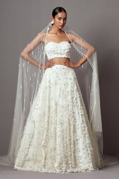 Ivory lehenga featuring embroidered 3-D bellflower motifs in jaal pattern, highlighted by pearls and crystals. Comes with matching embroidered strapless blouse and embellished trail dupatta. - Aza Fashions Tube Blouse, Bridal Sari, Sangeet Outfit, Reception Outfit, Lehenga Blouse Designs, Indo Western Dress, Indian Dresses Traditional, Bridal Lehengas, Lehenga Blouse