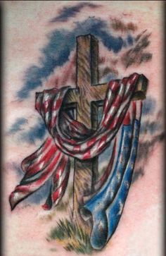 a cross with an american flag on it and some other items around it, all in the same color