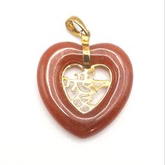 Red Jade Gold Heart Pendant Chinese Symbol  Red Jade Heart Pendant Measures 2-1/2" X  2-3/4" Chinese symbol in gold in center of heart Couldn't find any markings to indicate if it's gold and what carat. We have a receipt from HSN that indicates 14K Good pre-owned condition Valentine's Day Symbolic Heart-shaped Jewelry, Red Heart-shaped Engraved Jewelry, Red Engraved Heart-shaped Jewelry, Chinese Love Symbol, Mermaid Artwork, Love Symbol, Gold Heart Pendant, Red Jade, Chinese Symbols