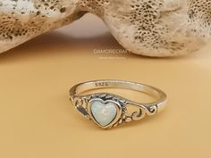 Materials: Sterling Silver Gemstone: Opal Gem color: White Band color: Silver/Rose gold Style: Minimalist Made to Order D E T A I L: Metal Type: sterling sliver (shown in the picture) ◆Size: US 6-10 ◆Center stone:  Opal ◆Gem color: White(shown in the picture) ◆Shape:3.3*3.3mm heart cut ◆Total weight:1.2g All of our jewelry are hypoallergenic and tarnish resistant. We wish to create lasting pieces that everyone can cherish, no matter the price point. O T H E R ∙ I N F O R M A T I O N * All items are nicely packaged ready to gift in elegant jewelry boxes. * If you can't find the information you need or need some advice for your design? Feel free to contact us. We are fast to reply :) T U R N ∙ A R O U N D ∙ T I M E * All items are custom made to order. Our turn around time is about 6 - 10 bu Handmade Heart Cut Wedding Rings, Heart Shaped 925 Stamped Rings For Wedding, Wedding Engagement Gifts, Pattern Ring, White Band, Boho Ring, Anniversary Wedding, Style Minimalist, Picture Size