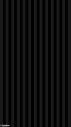 a black and white striped wallpaper with vertical stripes