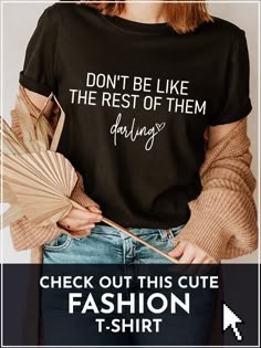 a woman wearing a t - shirt that says, don't be like the rest of them during fashion