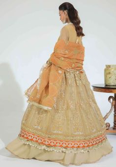 Brand: AVYANAProduct Code: Gulmehr DA-03 NuriCollection: Gulmehr Luxury Formals Unstitched Collection 2022Fabric: Organza Nuri, a symphony of radiant and vibrant color palette of mustard and rust-orange is composed on organza shirt, decked with modern mix of gold floral and abstract motifs with finishing of silk embroidered borders. Designed with trendy techniques of laser-cut, the dupatta is created in two complementing tones, representing style and grace. Avyana Gulmehr Embroidered Formals Col Pakistani Frocks, Wedding Frocks, Abstract Motifs, Organza Shirt, Pakistani Wedding Dress, Rust Orange, Pakistani Wedding, Fabric Stores Online, Style And Grace