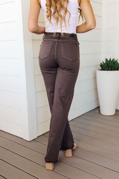 Feel your best in these Sybil High Rise Frayed Hem 90's Straight Jeans from Judy Blue. Crafted from garment-dyed fabric for a timeless look, they have a mid to high rise fit with a raw, frayed hem and a throwback 90's straight cut. With a distinctive, rich coca brown color, you'll want to wear them all season long! Judy Blue Mid to High Rise Zip Fly Black Hardware Garment Dyed 4-Way Stretch 90's Straight Cut Raw Hem 60% Cotton, 31% Rayon, 7% Elastrel-Poly, 2% Spandex True to Judy Blue Sizing 0/2 90s Trends, Straight Cut Jeans, Judy Blue Jeans, Jeans Online, Black Hardware, Dyed Fabric, Dress Romper, Straight Cut, Hat Hairstyles