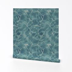 an abstract photo of blue water with ripples on it's surface canvas wall art print