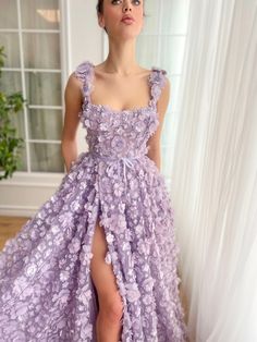 Lavender Petal Princess Gown | Teuta Matoshi Lavender Floor-length Wedding Dress, Lace Gown With Floral Applique And Fitted Bodice, Purple Lace Dress With Fitted Bodice, Lavender Floor-length Gown For Prom, Elegant Lavender Ball Gown Dress, Elegant Gown With Floral Applique And Lace, Floor-length Lavender Tulle Dress, Lace Evening Dress With Floral Applique For Gala, Gala Lace Evening Dress With Floral Applique