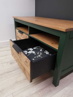 a wooden desk with drawers underneath it