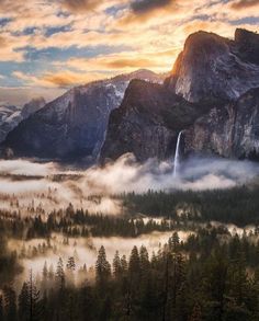 the valley is covered in fog and clouds