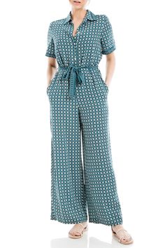 PRICES MAY VARY. QUALITY MATERIAL: Made of 100% polyester, Max Studio's button top short sleeve collar jumpsuit is designed to be lightweight and breathable. Available in a variety of colors and sizes, this particular jumpsuit is a women's size x-large in a teal med tulip wings all-over print. DRESS FEATURES: This printed jumpsuit is crafted with a collard neck that elegantly frames the neckline and short sleeves. It features a button-up front closure and a front waist tie that offers a snug fit