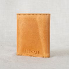 The Titus… the men’s trifold wallet you’ve been asking for! Crafted with durable, full-grain leather, this wallet boasts a classic design that's built to last. Over time, it develops a beautiful patina finish, adding character to its timeless style. With eight card slots and a designated cash spot, it offers both style and functionality. Handcrafted by artisans in India, it's a timeless accessory he'll cherish for years to come. Cheap Classic Trifold Wallet, Luxury Elegant Rectangular Trifold Wallet, Modern Brown Trifold Wallet, Modern Compact Leather Trifold Wallet, Modern Brown Rectangular Trifold Wallet, Custom Hand-tooled Rectangular Trifold Wallet, Brown Leather-lined Trifold Wallet, Wallet Shop, Spot It