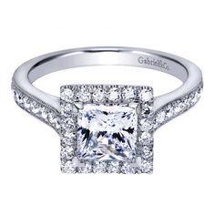 a princess cut diamond engagement ring set with pave diamonds on the shoulders and sides