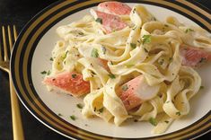 a plate with pasta and salmon on it