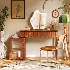 a room with a table, mirror and chair in it on the floor next to a potted plant