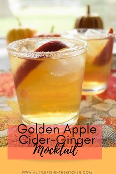 golden apple cider - ginger cocktail with an orange and cinnamon garnish on the rim