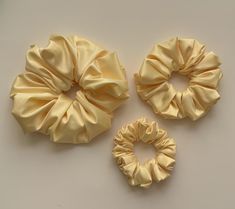 Add a touch of sophistication to your hair with our Pastel Yellow scrunchies! Handmade with precision & care, these scrunchies offer a smooth and comfortable feel that's perfect for any occasion. Our hair scrunchies are designed to provide a reliable hold without damaging your hair or leaving unwanted creases. The durable polyester material combines practicality with a chic look, making these scrunchies a stylish addition to your accessory collection. This handmade scrunchie is crafted from a lace like material, it is stretchy and delicate so we recommend handling it with care to ensure its longevity and maintain its elegant look. Available in three versatile sizes: Large: 7"-8" D, elastic 7"-8" Medium: 5"-5.5" D, elastic 7"-8" Small: 4"-4.5" D, elastic 7"-8" These elegant purple scrunchie Purple Scrunchie, Classy Hair, Handmade Scrunchie, Hair Scrunchies, Pastel Yellow, Scrunchie Hairstyles, Treat Yourself, Up Styles, Hair Ties