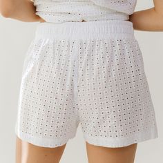 Whether you're lounging by the pool or heading to the beach, these shorts have you covered. A high-waisted fit and an elastic waistband mean ultimate comfort, and a 100% cotton eyelet fabric means breezy, beachy style. Beach coverup Elastic waistband High-waisted shorts Breezy, lightweight fabric Available as a matching set! FREE U.S. Standard Shipping! More info hereModel Hannah is wearing size XS100% COTTONHand wash cold and lay flat or hang to dry Cotton Shorts With Elastic Waistband For Warm Weather, Warm Weather Cotton Shorts With Elastic Waistband, Summer Shorts With Elastic Waistband For Day Out, Summer Shorts With Elastic Waistband For Warm Weather, Relaxed Fit Beachwear Shorts For Spring, Cotton Beach Bottoms For Summer, Summer Cotton Beach Bottoms, Summer Beachwear Pajama Shorts With Elastic Waistband, Summer Cotton Pajama Shorts With Elastic Waistband