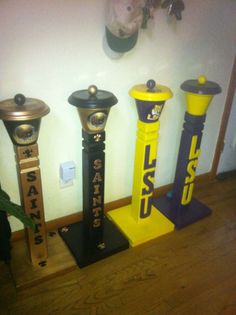 three different types of parking meters on display in a room with wood floors and white walls