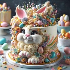 an elaborately decorated cake with bunny ears on top