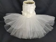 a white tutu skirt with flowers on it