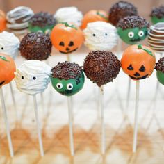 there are many cake pops with faces on them in the shape of pumpkins and jack - o'- lanterns